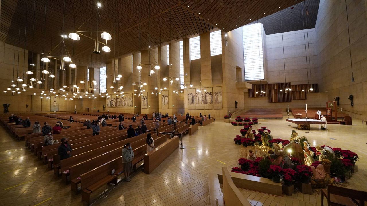 Worshipers gather for Christmas Eve Mass inside the Cathedral of Our Lady of the Angels, Dec 24, 2020, in Los Angeles. (AP Photo/Ashley Landis)