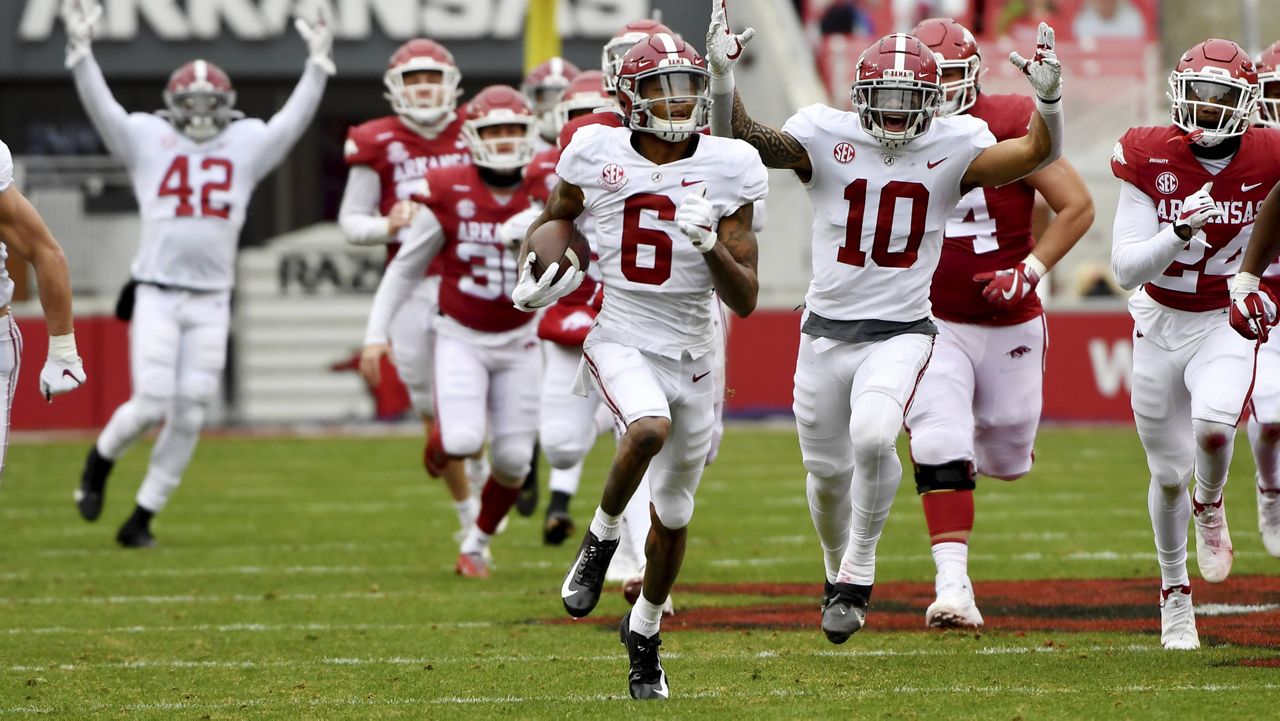 Alabama's DeVonta Smith (6) returns a punt for a touchdown against Arkansas on Dec. 12. (AP Photo/Michael Woods)