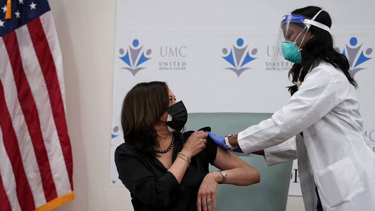 Vice President-elect Kamala Harris receives the Moderna COVID-19 vaccine from nurse Patricia Cummings on Tuesday. (AP Photo/Jacquelyn Martin)