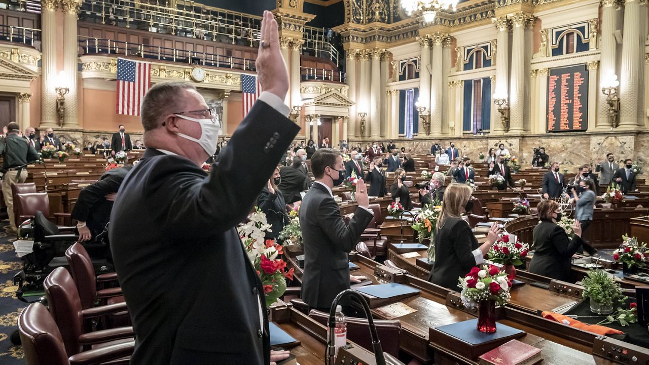 First term legislators of the Pennsylvania House of Representatives are sworn-in Tuesday at the state Capitol in Harrisburg, Pa. (AP Photo/Laurence Kesterson)