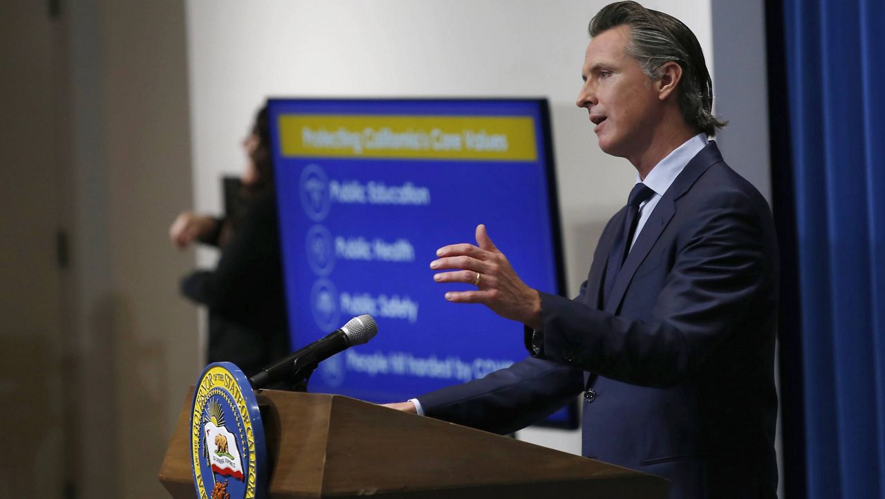 California Gov. Gavin Newsom discusses his revised 2020-2021 state budget during a news conference in Sacramento, Calif. on May 14, 2020. (AP Photo/Rich Pedroncelli, Pool, File)