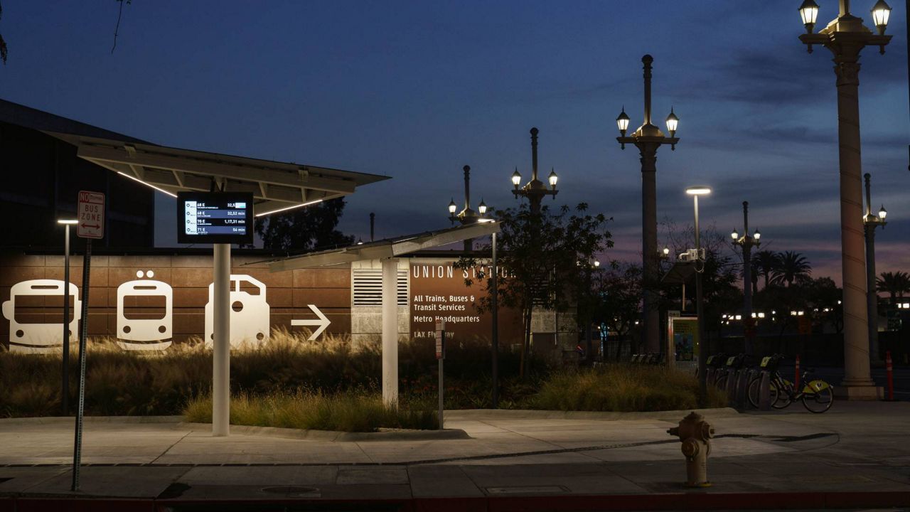 An empty Metro bus stop is seen next to Union Station in Los Angeles late afternoon, Jan. 5, 2021. (AP Photo/Damian Dovarganes)