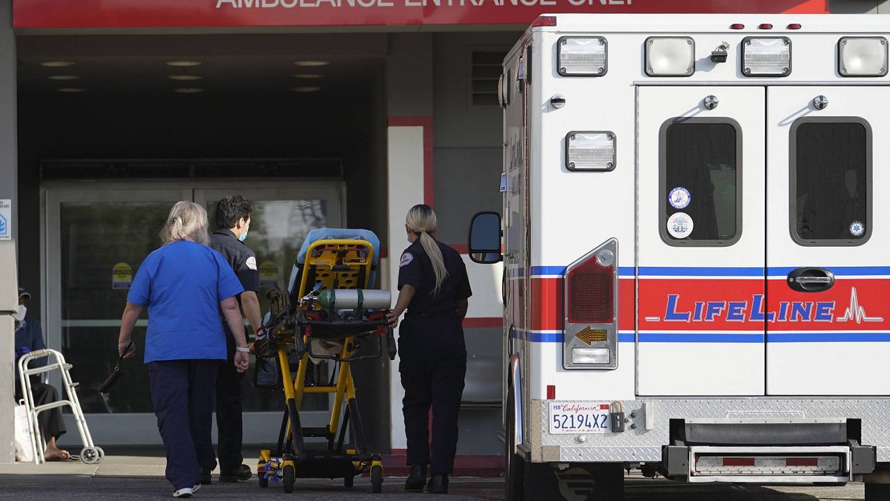 In this Jan. 5, 2021 file photo a LifeLine Ambulance arrives at the CHA Hollywood Presbyterian Medical Center (CHA HPMC) in Los Angeles. (AP Photo/Damian Dovarganes, File)