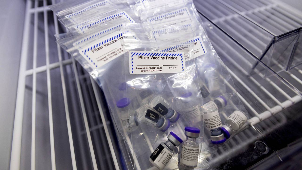 Vials of the Pfizer-BioNTech COVID-19 vaccine rest in cold storage at UC Davis Health on Tuesday, Jan. 12, 2021, in Sacramento, Calif. (AP Photo/Noah Berger, Pool)