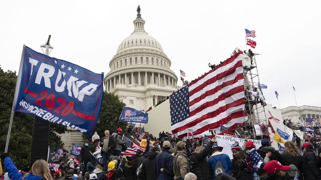In this Jan. 6, 2021, file photo, supporters of President Donald Trump stand outside the U.S. Capitol in Washington. (AP Photo/Jose Luis Magana, File)