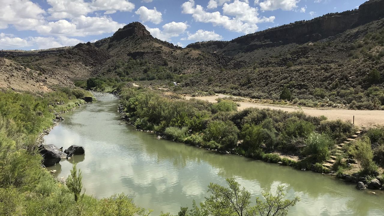FILE - This Aug. 6, 2018, file photo shows the Rio Grande flowing south of Taos, New Mexico. (AP Photo/Susan Montoya Bryan, File)