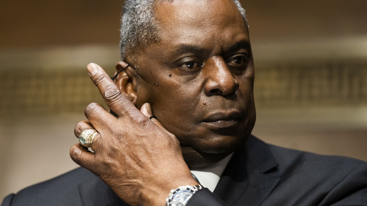 Secretary of Defense nominee Lloyd Austin, a recently retired Army general, removes his face mask during his conformation hearing before the Senate Armed Services Committee on Capitol Hill, Tuesday, Jan. 19, 2021, in Washington. (Jim Lo Scalzo/Pool via AP)