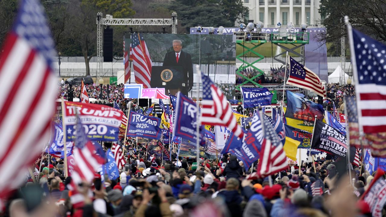 FILE - In this Jan. 6, 2021, file photo with the White House in the background, President Donald Trump supporters listen as he speaks during a rally in Washington. (AP Photo/Julio Cortez, File)