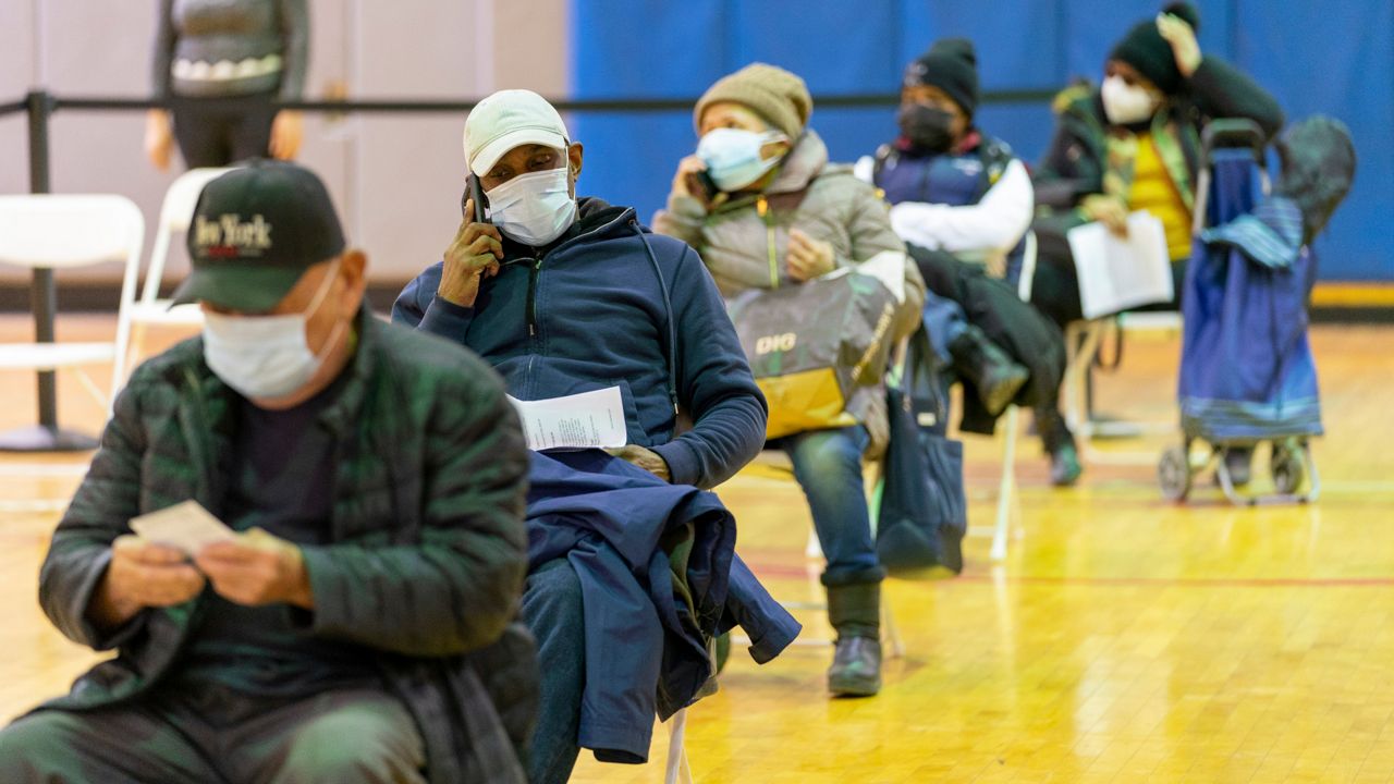Seniors wait in the recovery area after receiving the first dose of the coronavirus vaccine at the Bronx River Community Center, Sunday, Jan. 31, 2021. (AP Photo/Mary Altaffer)