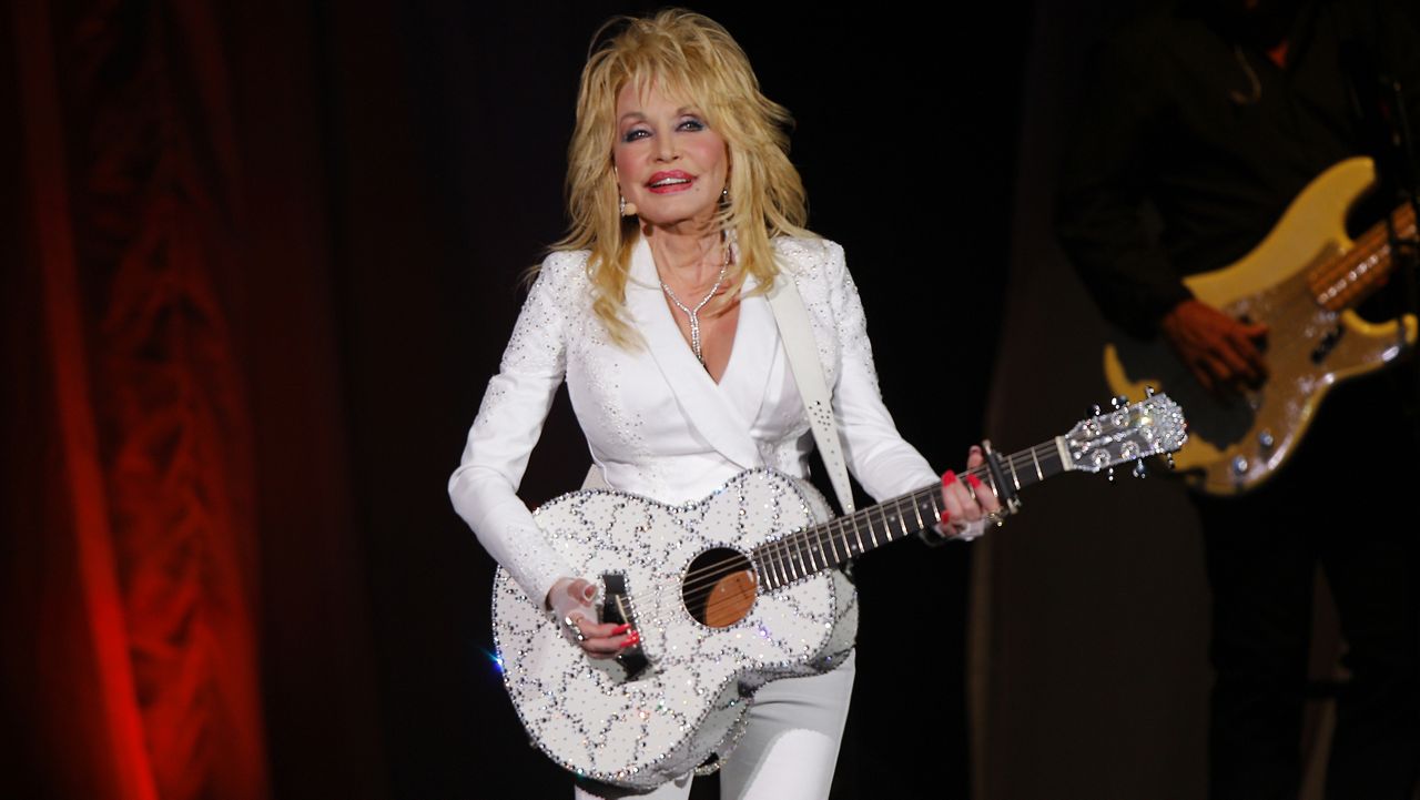 FILE - Dolly Parton performs in concert on July 31, 2015, in Nashville, Tenn. (Photo by Wade Payne/Invision/AP, File)