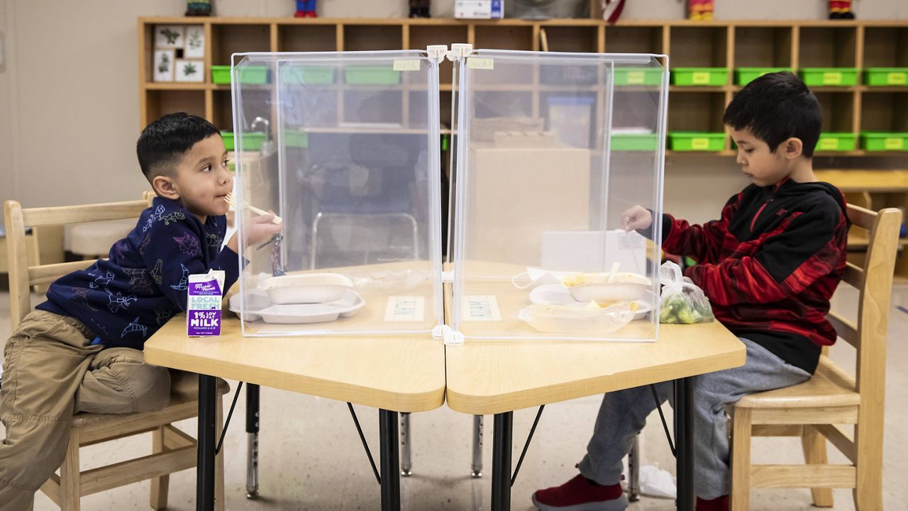 Preschool students eat lunch at Dawes Elementary in Chicago. (Ashlee Rezin Garcia/Chicago Sun-Times via AP, Pool, File)