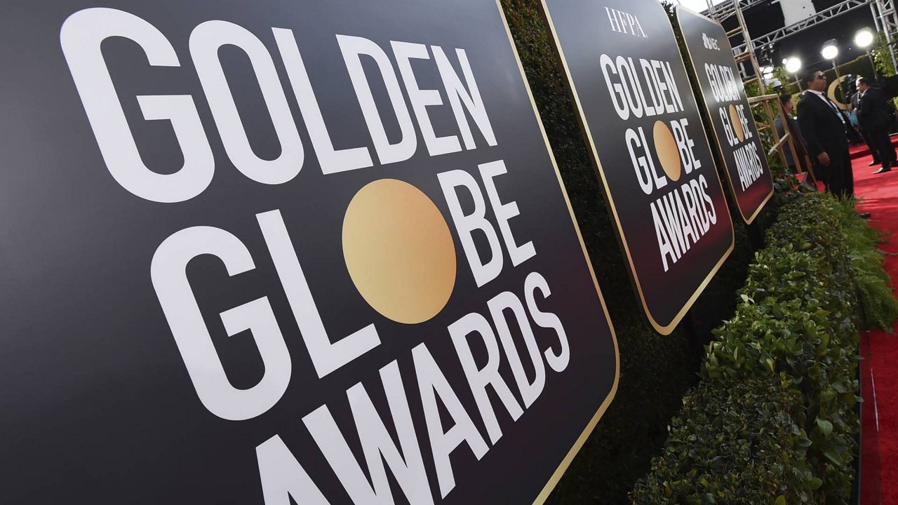 Event signage appears above the red carpet at the 77th annual Golden Globe Awards, Sunday, Jan. 5, 2020, in Beverly Hills, Calif. (Photo by Jordan Strauss/Invision/AP, File)