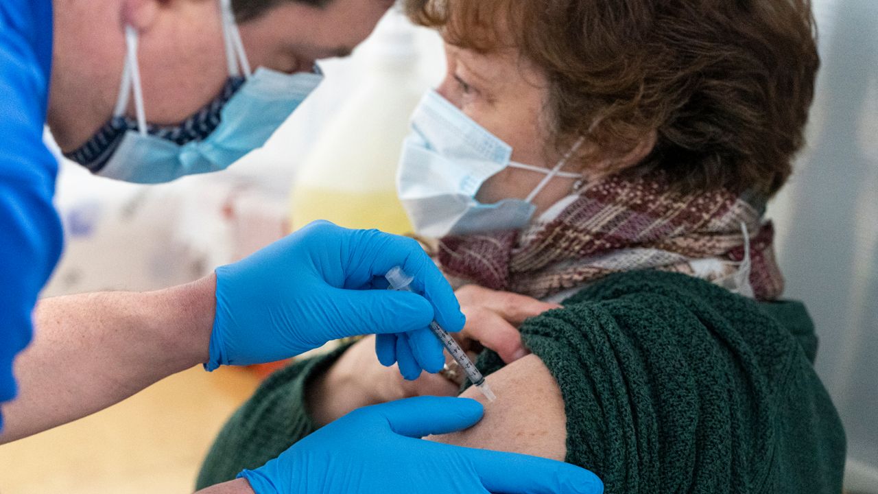 A nurse administers the first dose of the COVID-19 vaccine at a pop-up COVID-19 vaccination site at the God's Battalion of Prayer Church, in Brooklyn. (AP Photo/Mary Altaffer)