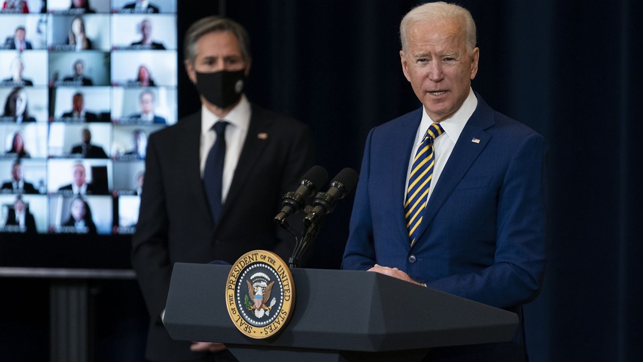 Secretary of State Antony Blinken listens as President Joe Biden delivers remarks to State Department staff, Thursday, Feb. 4, 2021, in Washington. (AP Photo/Evan Vucci)