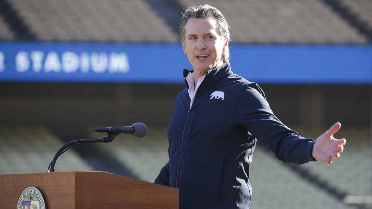 In this Jan. 15, 2021 file photo, Gov. Gavin Newsom addresses a press conference held at the launch of a mass COVID-19 vaccination site at Dodger Stadium. (Irfan Khan/Los Angeles Times via AP, Pool)