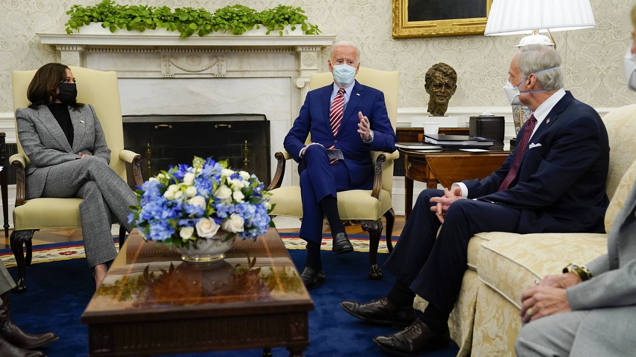 President Joe Biden, accompanied by Vice President Kamala Harris, speaks Thursday during a meeting with lawmakers on investments in infrastructure in the White House's Oval Office. (AP Photo/Evan Vucci)