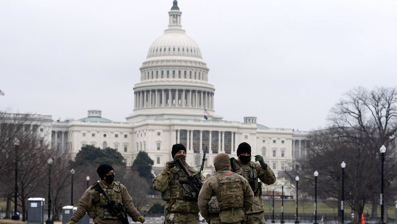 Members of the National Guard patrol the area outside of the U.S. Capitol on Feb. 11. (AP Photo/Jose Luis Magana)