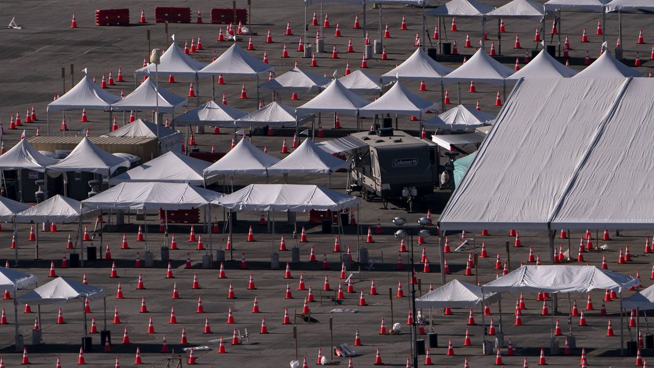A temporarily closed COVID-19 vaccination site is seen at Dodger Stadium in Los Angeles, Friday, Feb. 12, 2021. (AP Photo/Jae C. Hong)