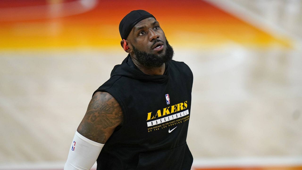 Lakers forward LeBron James warms up before their NBA game against the Utah Jazz Wednesday, Feb. 24, 2021, in Salt Lake City. (AP Photo/Rick Bowmer)