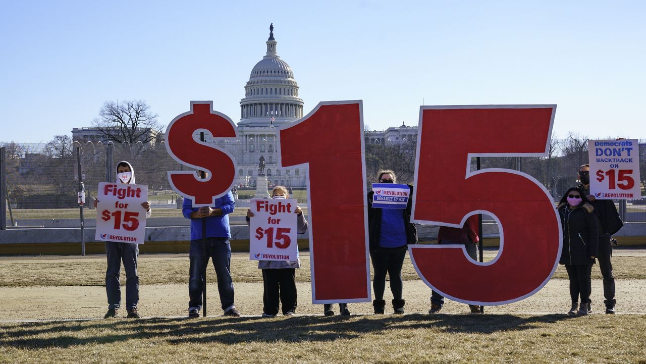 Activists appeal for a $15 minimum wage near the Capitol in Washington, Thursday, Feb. 25, 2021. (AP Photo/J. Scott Applewhite)