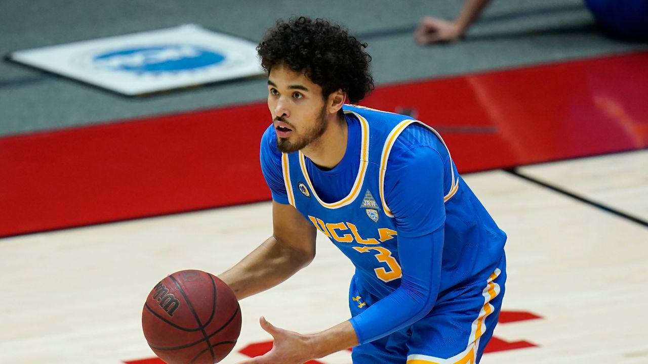 UCLA guard Johnny Juzang (3) brings the ball up court in the first half during an NCAA college basketball game against Utah Thursday, Feb. 25, 2021, in Salt Lake City. (AP Photo/Rick Bowmer)