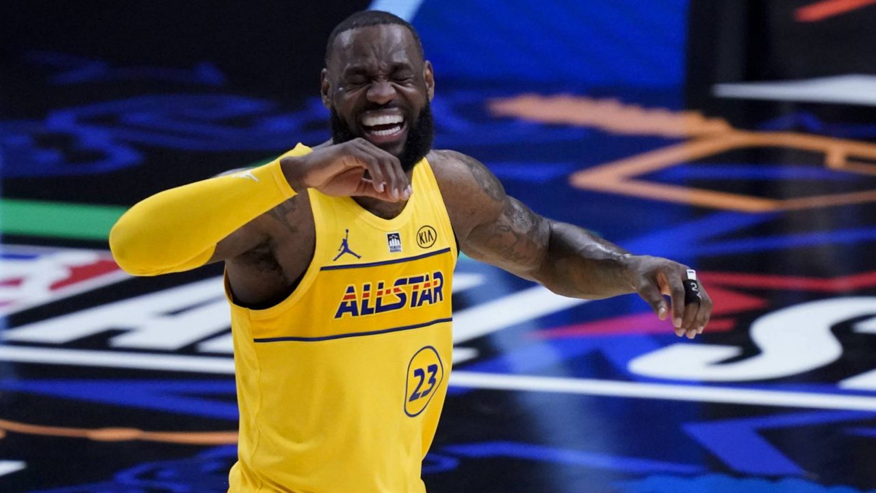 Lakers forward LeBron James smiles during the first half of basketball's NBA All-Star Game in Atlanta, Sunday, March 7, 2021. (AP Photo/Brynn Anderson)