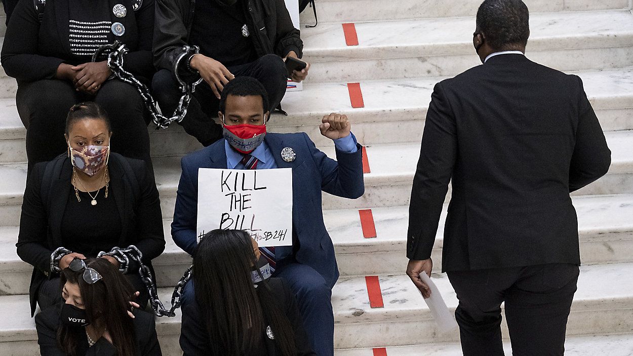 Demonstrators protest against Georgia's voting bill. (AP Photo / File)