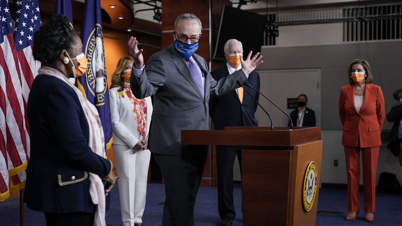 Senate Majority Leader Chuck Schumer, D-N.Y., speaks at a news conference on passage of gun violence prevention legislation, at the Capitol in Washington, Thursday, March 11, 2021. From left are, Rep. Sheila Jackson Lee, D-Tex., Rep. Lucy McBath, D-Ga., Rep. Mike Thompson, D-Calif., chairman of the House Gun Violence Prevention Task Force, and Speaker of the House Nancy Pelosi, D-Calif., holds (AP Photo/J. Scott Applewhite)