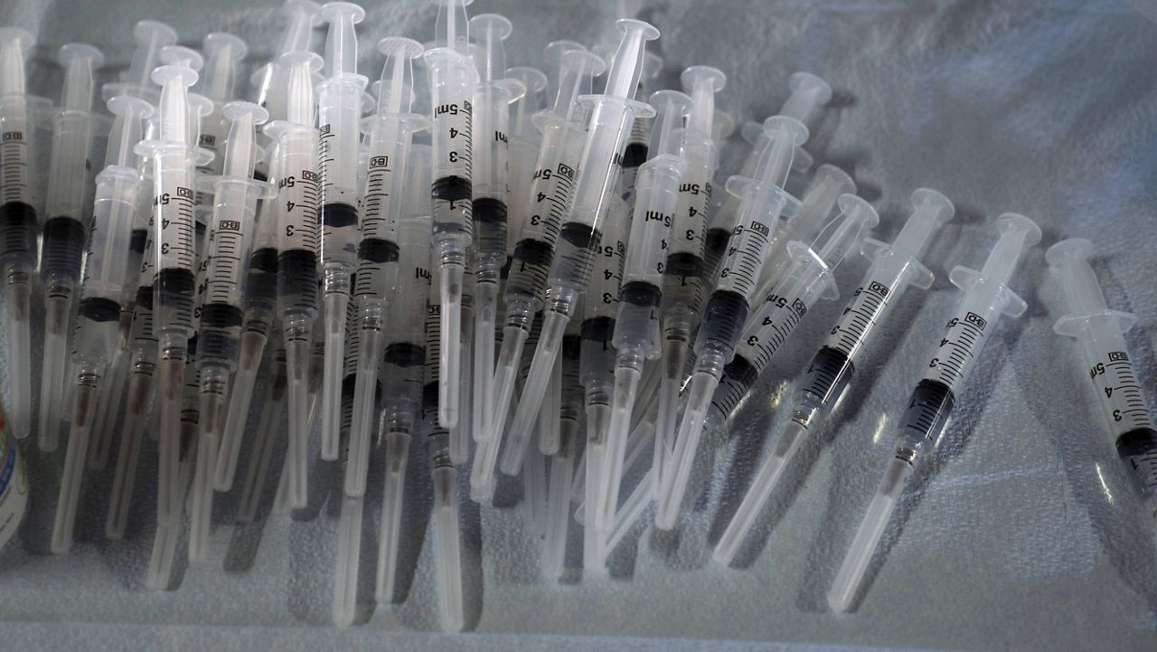 In this March 5, 2021, file photo, syringes prepared with Pfizer's COVID-19 vaccine sit at a vaccination site in Long Beach, Calif. (AP Photo/Jae C. Hong, File)