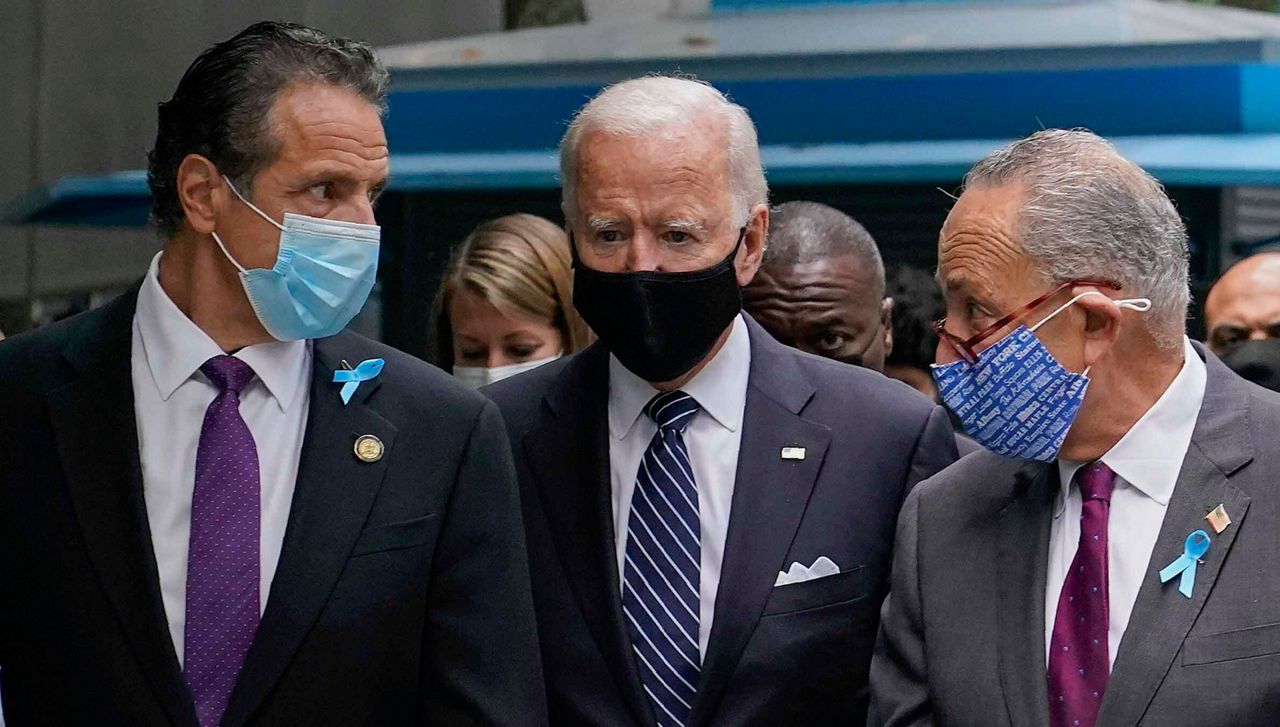 FILE - This photo from Friday, Sept. 11, 2020, shows President Joe Biden, center, as a presidential candidate walking with New York Gov. Andrew Cuomo, left, and Sen. Chuck Schumer of N.Y., after arriving for a ceremony marking the 19th anniversary of the Sept. 11 terrorist attacks. (AP Photo/Patrick Semansky, File)