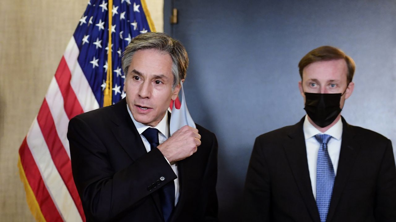 Secretary of State Antony Blinken, accompanied by National Security Adviser Jake Sullivan, right, talks to the media after a closed-door morning session of US-China talks in Anchorage, Alaska on Friday, March 19, 2021. (Frederic J. Brown/Pool via AP)