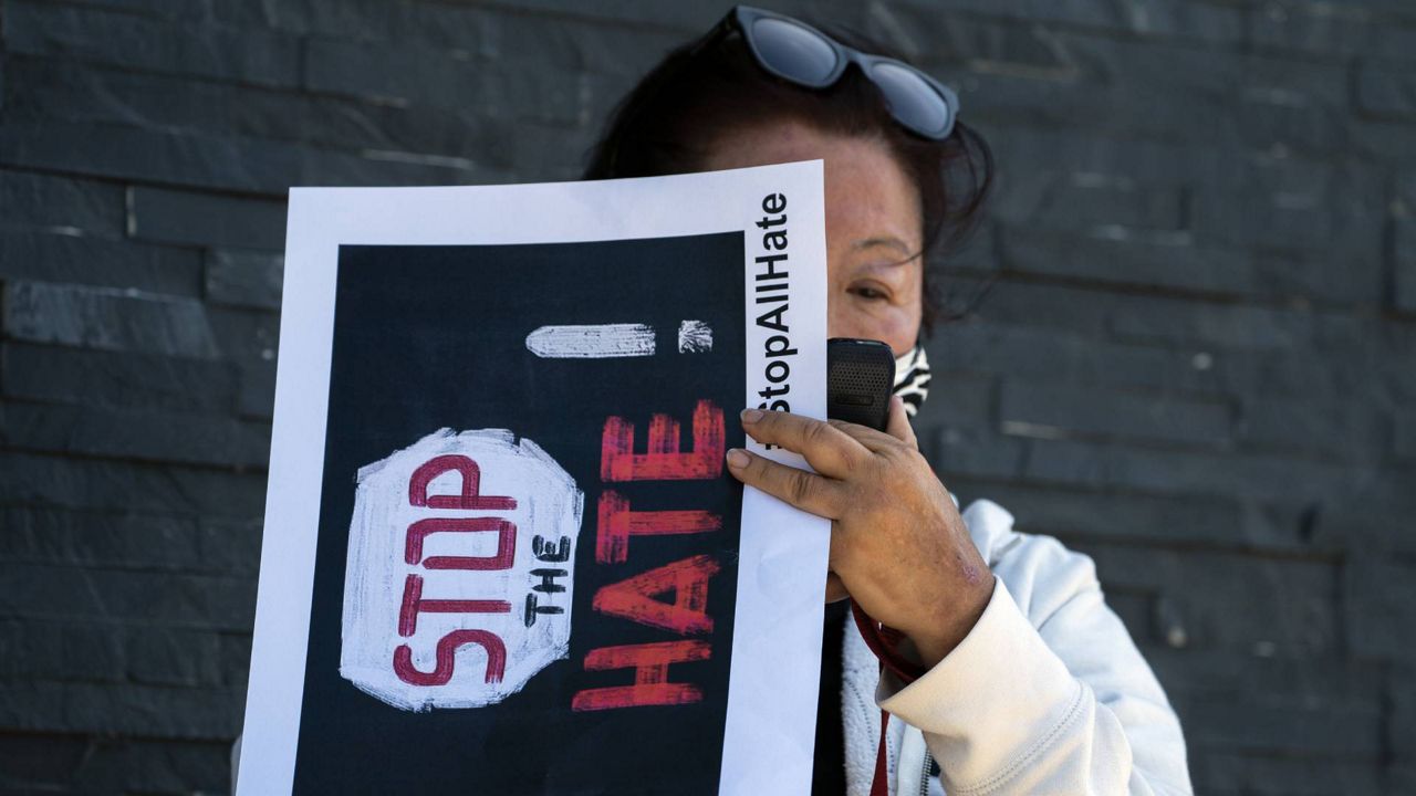 A member of the community participates in a rally to denounce hate against the Asian American and Pacific Islander communities in the Koreatown neighborhood in Los Angeles, March 19, 2021. (AP Photo/Damian Dovarganes)