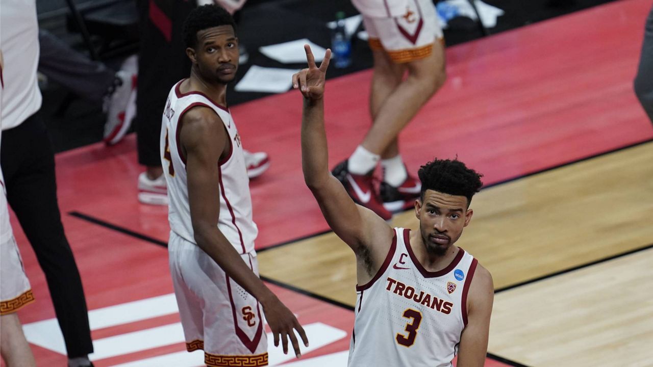 USC forward Isaiah Mobley (3) waves to fans after beating Drake 72-56 during a men's college basketball game in the NCAA tournament at Bankers Life Fieldhouse in Indianapolis, Saturday, March 20, 2021. (AP Photo/Paul Sancya)