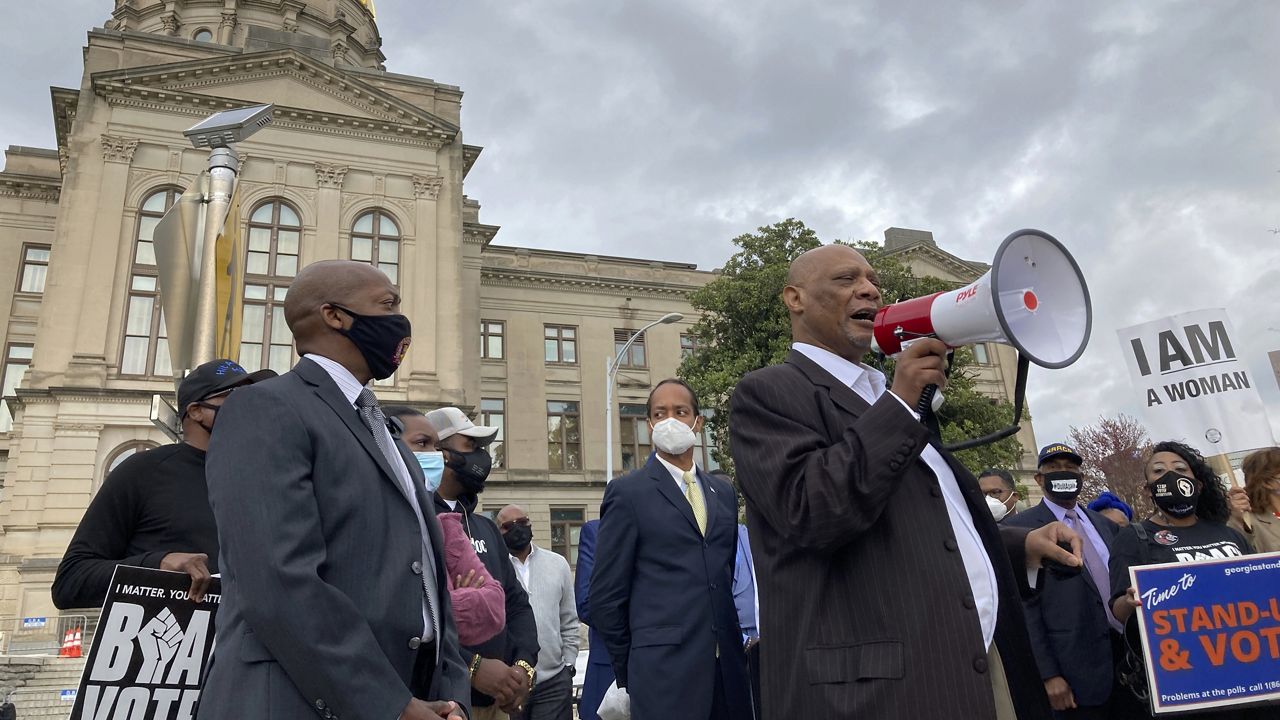 African Methodist Episcopal Church Bishop Reginald Jackson announces a boycott of Coca-Cola Co. products outside the Georgia Capitol on Thursday, March 25, 2021 in Atlanta. (AP Photo/Jeff Amy)