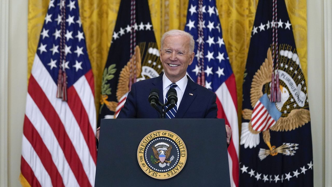 President Joe Biden smiles as he speaks during a news conference in the East Room of the White House, Thursday, March 25, 2021, in Washington. (AP Photo/Evan Vucci)