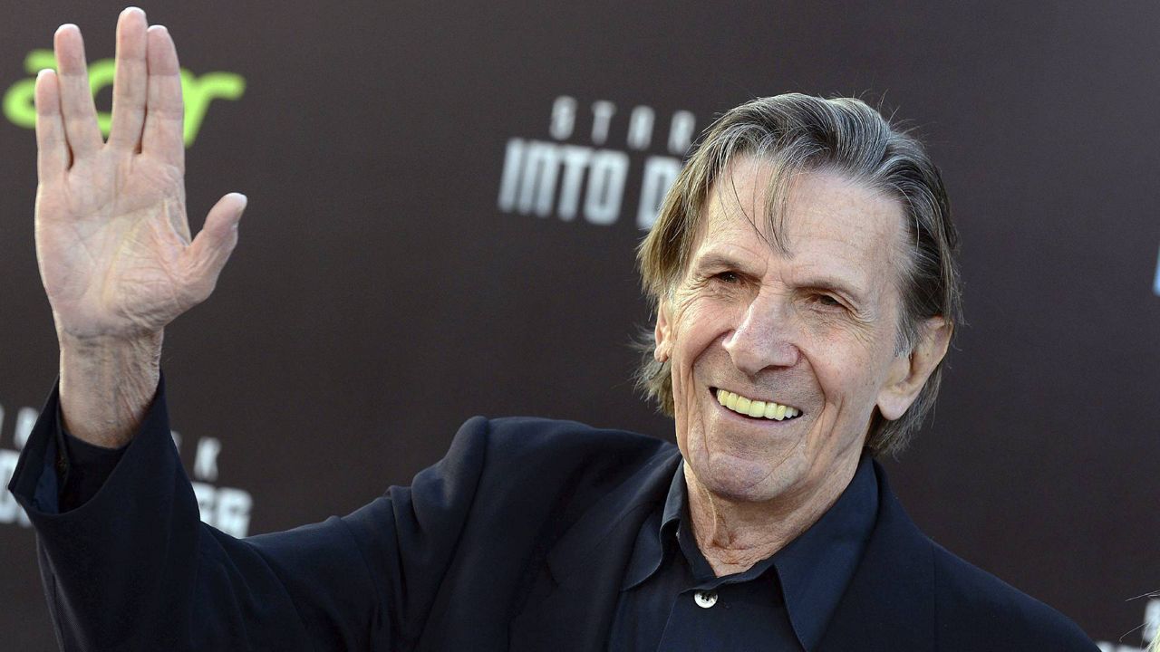 In this May 14, 2013 file photo, Leonard Nimoy gives a "Live Long and Prosper" hand gesture as he arrives at the LA premiere of “Star Trek Into Darkness.” (Photo by Jordan Strauss/Invision/AP)