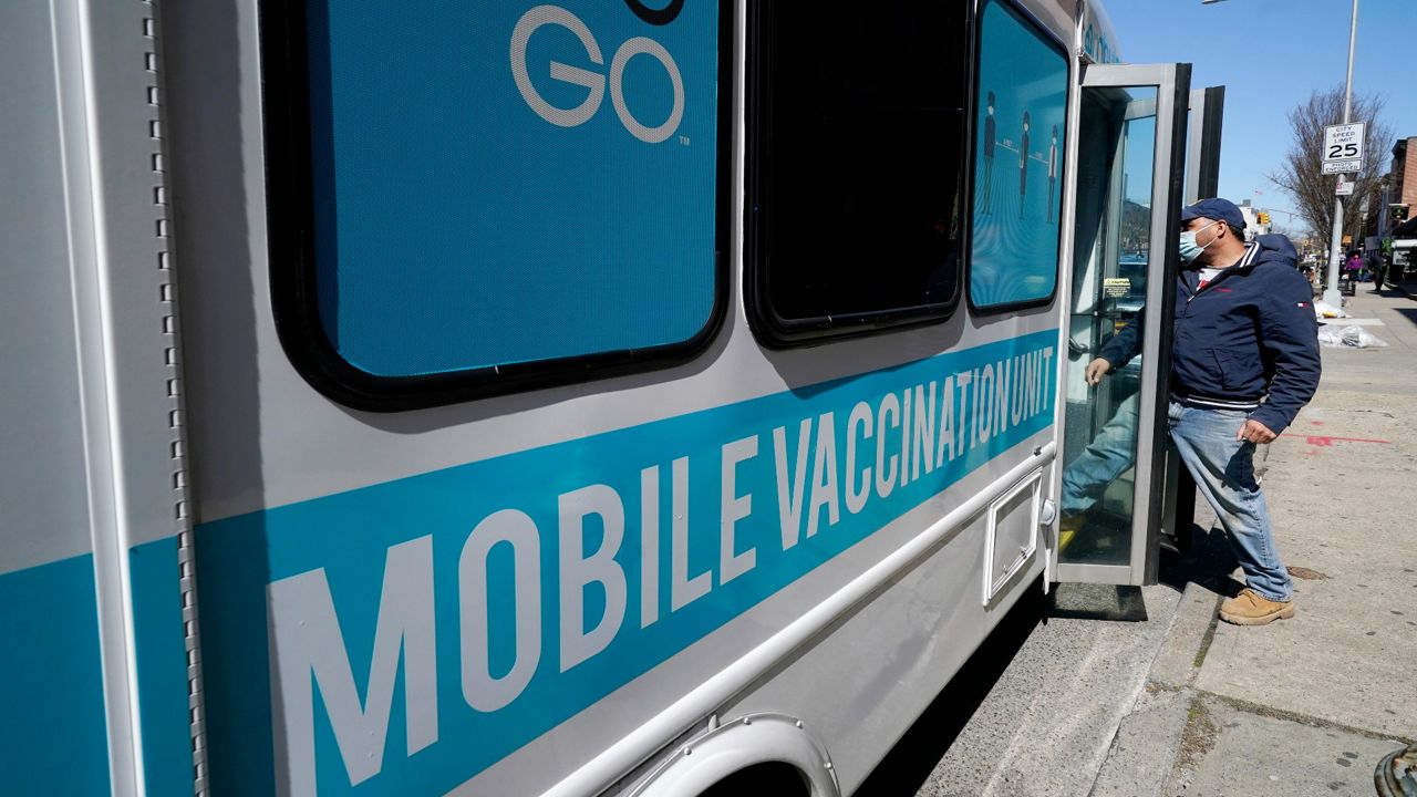 A man received a vaccination at a mobile clinic in Sunset Park, part of a partnership between the city's Test and Trace Corps and Mixteca, a community organization serving Spanish-speaking and Latin American residents. (AP Photo/Kathy Willens)