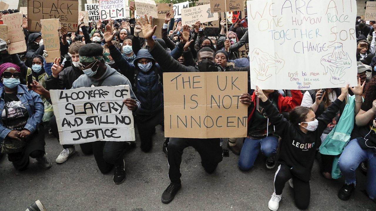 Demonstrators gather outside Downing Street during a Black Lives Matter march in London on June 6, 2020. (AP Photo/Frank Augstein, File)