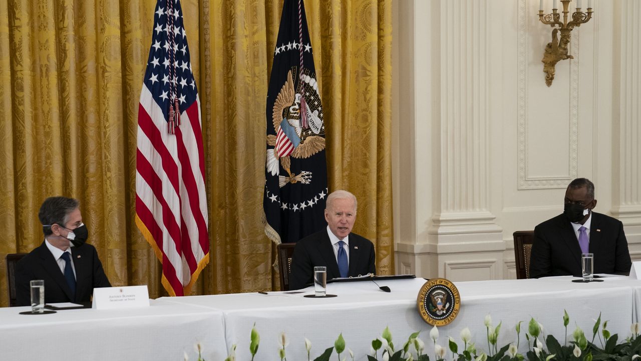 Secretary of State Antony Blinken, left, and Secretary of Defense Lloyd Austin listen as President Joe Biden speaks during a Cabinet meeting in the East Room of the White House, Thursday, April 1, 2021, in Washington. (AP Photo/Evan Vucci)