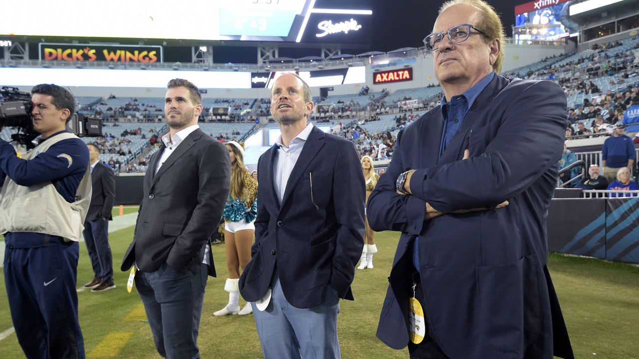 Los Angeles Chargers Chairman of the Board Dean Spanos, right, president of business operations A.G. Spanos, center, and personnel assistant Michael Spanos II on Dec. 8, 2019. (AP Photo/Phelan M. Ebenhack)