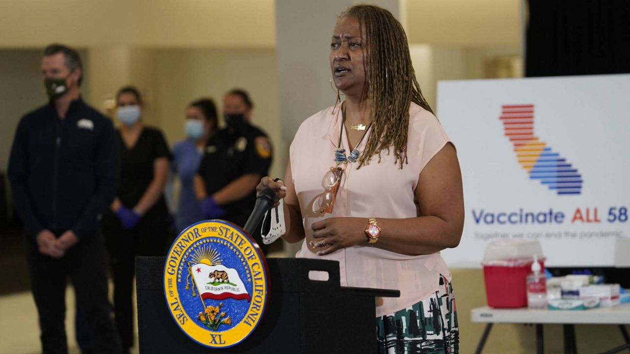 Los Angeles County Supervisor Holly Mitchell takes questions from the media about the Johnson & Johnson coronavirus vaccine at the Baldwin Hills Crenshaw Plaza in LA, April 1, 2021. (AP Photo/Damian Dovarganes)
