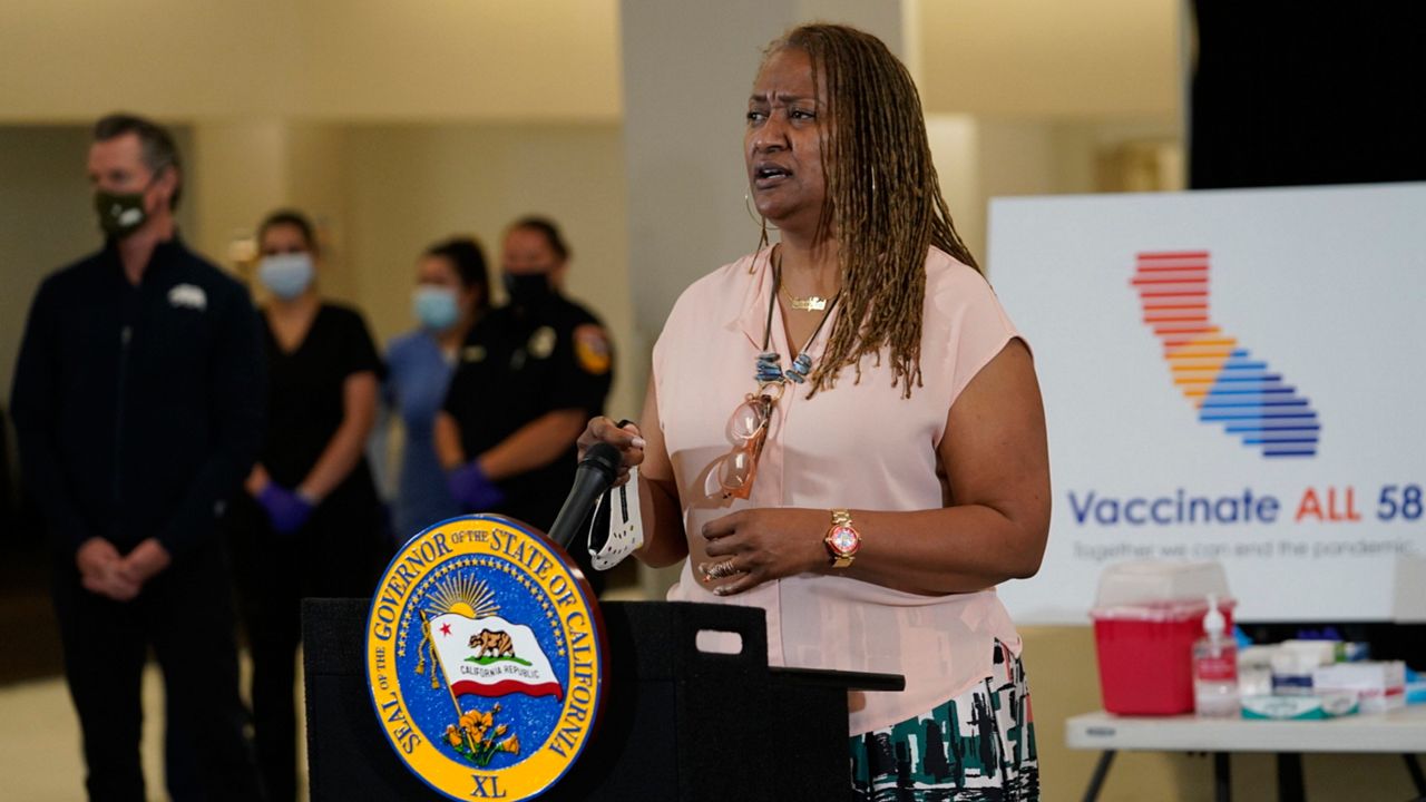 Los Angeles County Supervisor Holly Mitchell takes questions from the media about the Johnson & Johnson coronavirus vaccine at the Baldwin Hills Crenshaw Plaza in Los Angeles Thursday, April 1, 2021. (AP Photo/Damian Dovarganes)