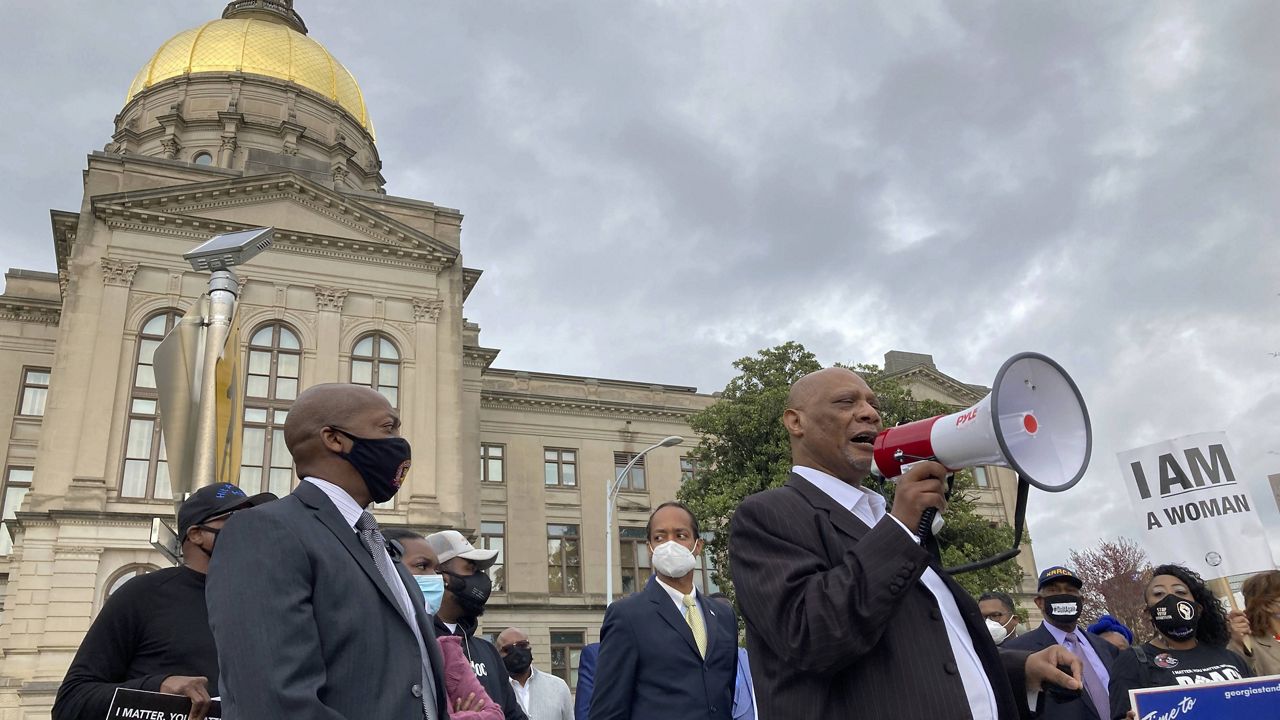 In this March 25, 2021, file photo, African Methodist Episcopal Church Bishop Reginald Jackson announces a boycott of Coca-Cola Co. products outside the Georgia Capitol n Atlanta. (AP Photo/Jeff Amy, File)