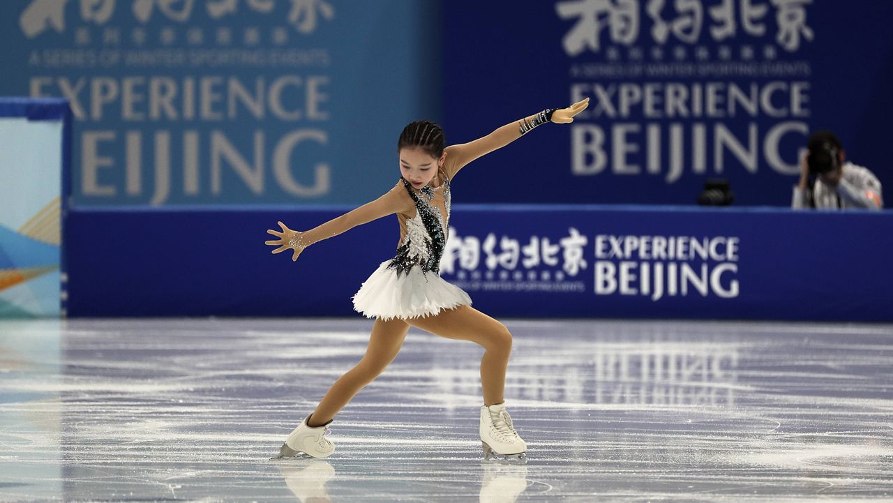 Chinese figure skater Xu Jingyu performs during a test event for the 2022 Beijing Winter Olympics at the Capital Indoor Stadium in Beijing on Sunday. (AP Photo/Andy Wong)