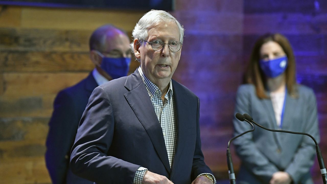 Senate Minority Leader Mitch McConnell, R-Ky., listens to a reporter's question during a press conference at a COVID-19 vaccination site in Lexington, Ky., Monday, April 5, 2021. (AP Photo/Timothy D. Easley)