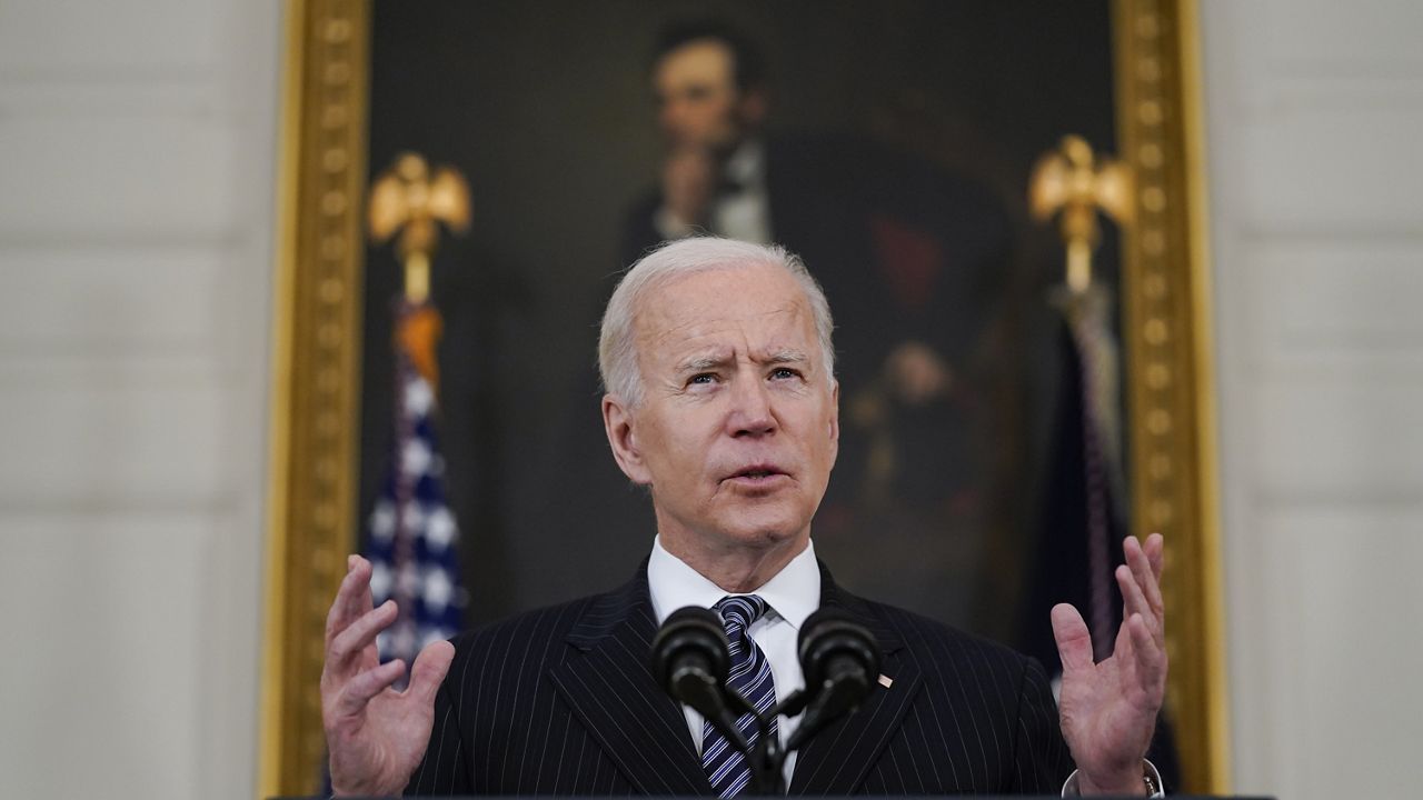 President Joe Biden delivers remarks about vaccinations, in the State Dining Room of the White House, Tuesday, April 6, 2021, in Washington. (AP Photo/Evan Vucci)