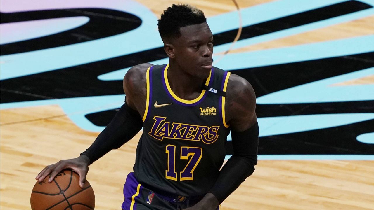 Los Angeles Lakers guard Dennis Schroder (17) dribbles the ball during a NBA basketball game against the Miami Heat, Thursday, April 8, 2021, in Miami. (AP Photo/Marta Lavandier)