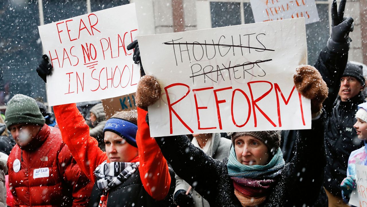 FILE - In this March 24, 2018, file photo, demonstrators march through downtown during the "March for Our Lives" protest for gun legislation and school safety in Cincinnati that was spearheaded by teens from Marjory Stoneman Douglas High School after the 2018 mass shooting in Parkland, Fla. (AP Photo/John Minchillo)