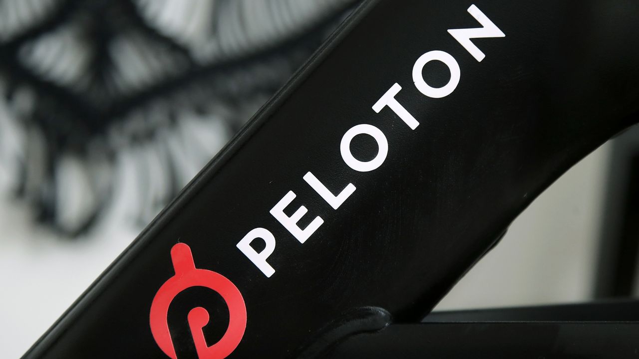 File Photo: Peloton's logo, as seen on one of the company's stationary bicycles in San Francisco. The recalls were on the company's treadmill machines, not its bikes. (AP Photo/Jeff Chiu, File)