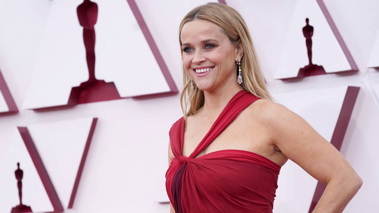 Reese Witherspoon arrives at the Oscars on April 25, 2021, at Union Station in Los Angeles. (AP Photo/Chris Pizzello, Pool)